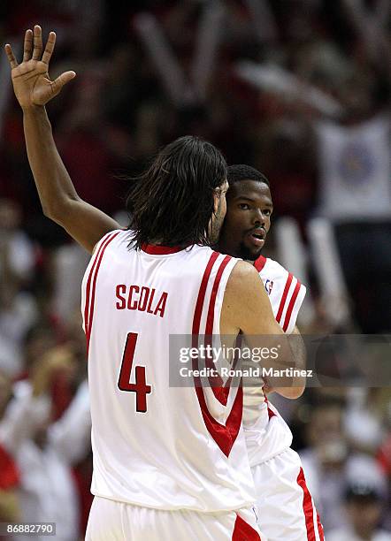 Guard Aaron Brooks celebrates a three-point shot with Luis Scola of the Houston Rockets against the Los Angeles Lakers in Game Four of the Western...