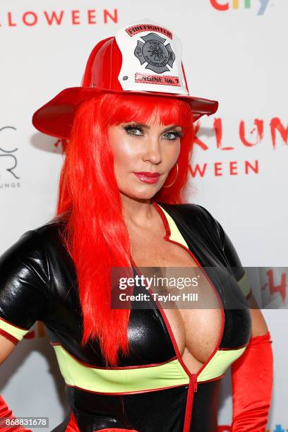 Coco Austin attends Heidi Klum's 18th annual Halloween Party presented by Party City at the Magic Hour Rooftop Bar & Lounge on October 31, 2017 in...