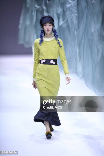 Model showcases designs on the runway at the A Life On The Left collection by designer Lin Qi during the Mercedes-Benz China Fashion Week...