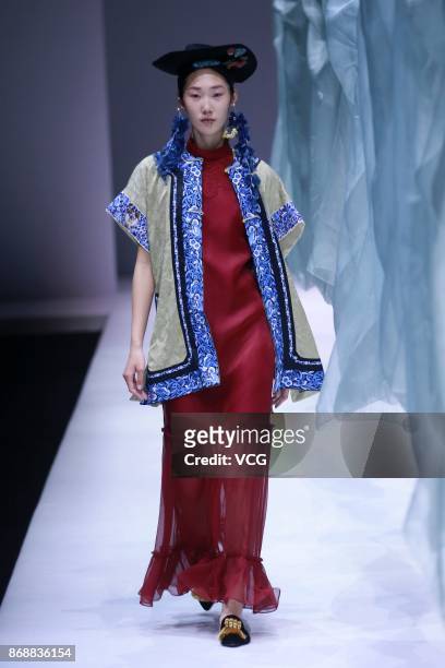 Model showcases designs on the runway at the A Life On The Left collection by designer Lin Qi during the Mercedes-Benz China Fashion Week...