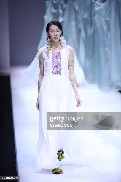 Model showcases designs on the runway at the A Life On The Left collection by designer Lin Qi during the Mercedes-Benz China Fashion Week...