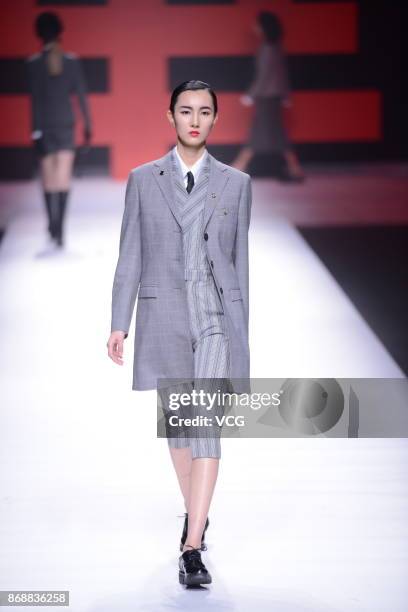 Model showcases designs on the runway at Yudahua 1919 collection during the Mercedes-Benz China Fashion Week Spring/Summer 2018 at Beijing Hotel on...