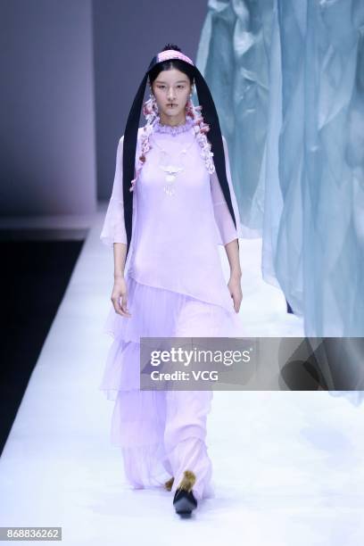 Model showcases designs on the runway at the A Life On The Left collection by designer Lin Qi during the Mercedes-Benz China Fashion Week...