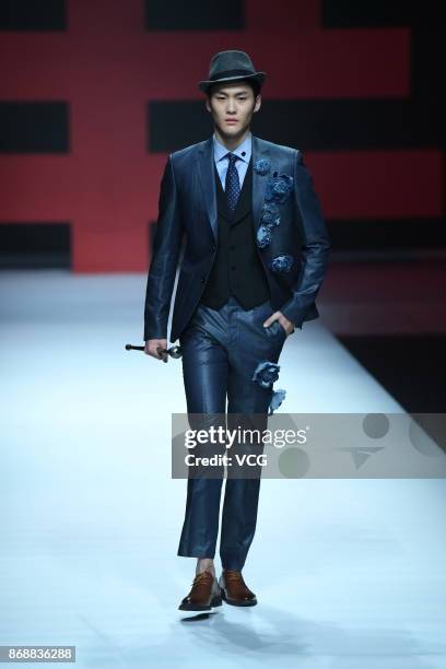 Model showcases designs on the runway at Yudahua 1919 collection during the Mercedes-Benz China Fashion Week Spring/Summer 2018 at Beijing Hotel on...