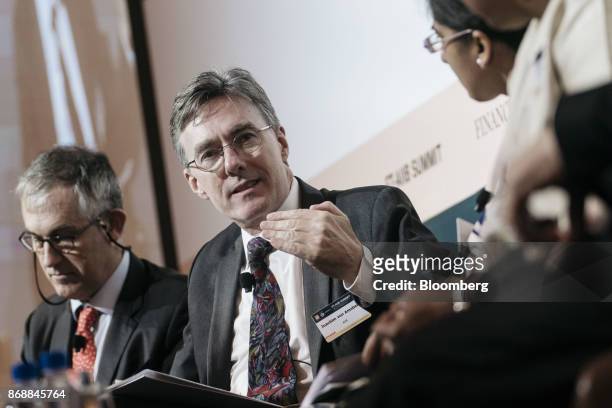 Joachim von Amsberg, vice president of policy and strategy at the Asian Infrastructure Investment Bank , center, speaks during the FT-AIIB Summit in...