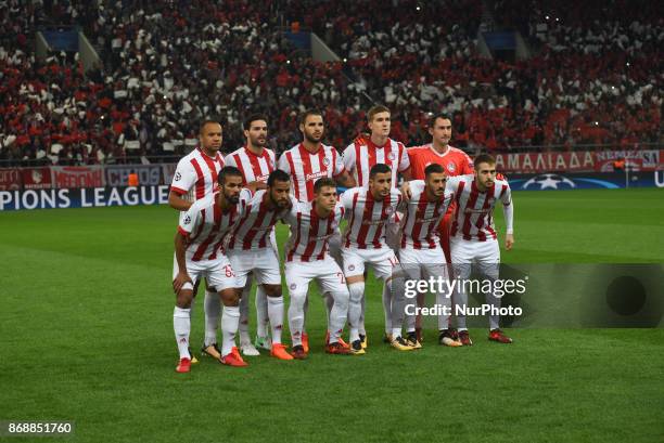 Olympiakos team players Olympiacos' Moroccan midfielder Mehdi Carcela-Gonzalez, Olympiacos' French-Togolese midfielder Alaixys Romao, Olympiacos'...