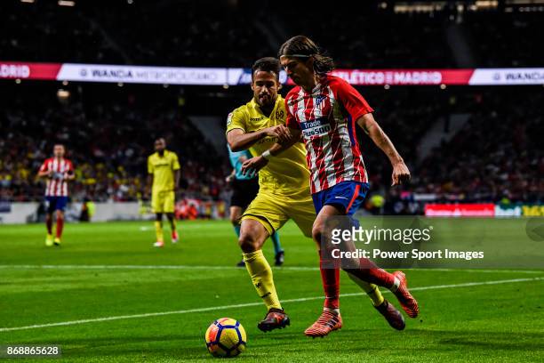 Filipe Luis of Atletico de Madrid vies for the ball with Mario Gaspar Perez Martínez of Villarreal CF during the La Liga 2017-18 match between...