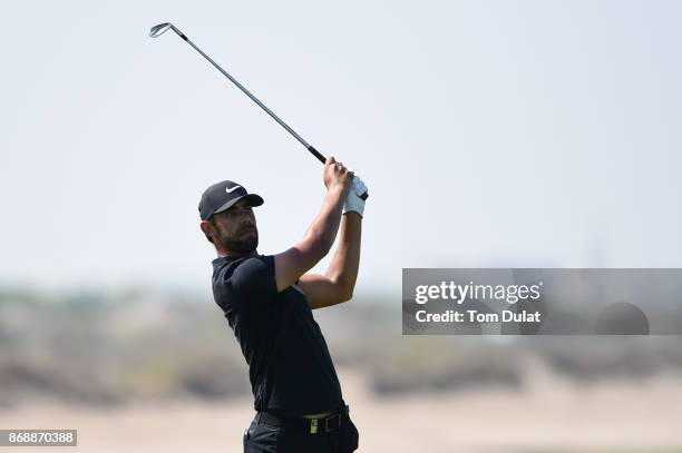 Erik Van Rooyen of South Africa hits an approach shot on the 9th hole during day one of the NBO Golf Classic Grand Final at Al Mouj Golf on November...