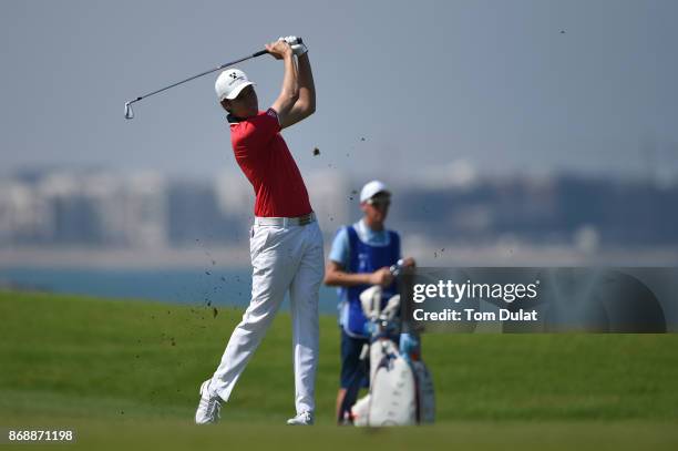 Steven Brown of England hits an approach shot on the 9th hole during day one of the NBO Golf Classic Grand Final at Al Mouj Golf on November 1, 2017...