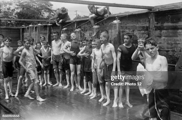 Boys camp, shower. USA 1915.