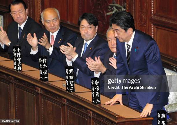 Prime Minister Shinzo Abe acknowledges the applause after his re-election during the Lower House plenary session at the Diet Building on November 1,...