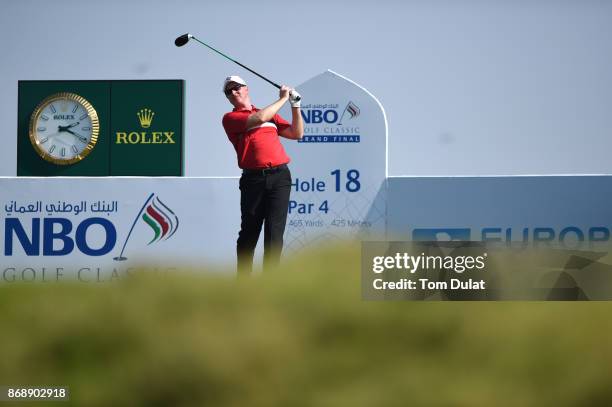 Richard McEvoy of England tees off on the 18th hole during day one of the NBO Golf Classic Grand Final at Al Mouj Golf on November 1, 2017 in Muscat,...