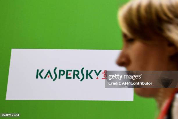 Woman passes the logo of Kaspersky Lab, Russia's leading antivirus software development company, during the 10th Russian Internet Week in Moscow on...