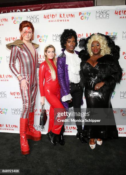 John Fugelsang, Elizabeth Wagmeister, Carlos Greer, and Bevy Smith attend Heidi Klum's 18th Annual Halloween Party at Magic Hour Rooftop Bar & Lounge...