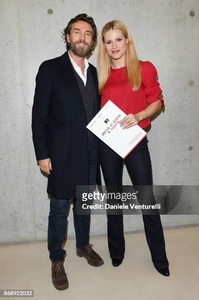 Alessio Boni and Michelle Hunziker attends Doppia Difesa - Uccisa In Attesa Di Giudizio screening during the 12th Rome Film Fest at Maxxi on November...