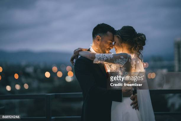 bride and groom enjoying in their love - wedding symbols stock pictures, royalty-free photos & images