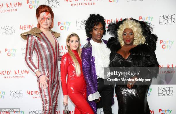 John Fugelsang, Elizabeth Wagmeister, Carlos Greer, and Bevy Smith attend Heidi Klum's 18th Annual Halloween Party at Magic Hour Rooftop Bar & Lounge...