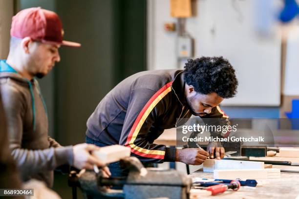 Berlin, Germany Refugee work at arrivo excercise workshop of Berlin chamber of crafts on October 30, 2017 in Berlin, Germany.