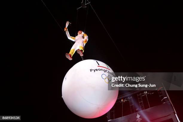 Ryu Seung-min, a member of Athletes Commission of the International Olympic Committee, is suspended in the air while carrying the Olympic torch to...