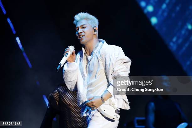 Taeyang performs on stage to celebrate 100 days to go and the PyeongChang 2018 Winter Olympics torch during a torch relay on November 1, 2017 in...
