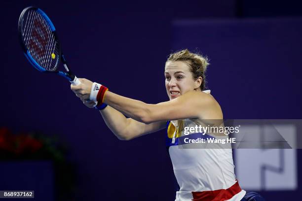 Anastasia Pavlyuchenkova of Russia hits a return in her match against Ashleigh Barty of Australia during the WTA Elite Trophy Zhuhai 2017 at Hengqin...