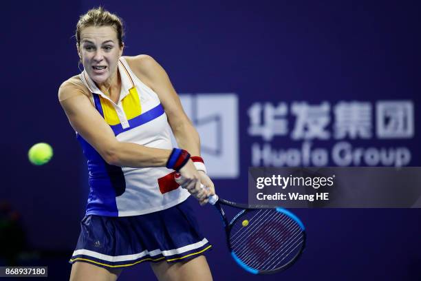 Anastasia Pavlyuchenkova of Russia hits a return in her match against Ashleigh Barty of Australia during the WTA Elite Trophy Zhuhai 2017 at Hengqin...