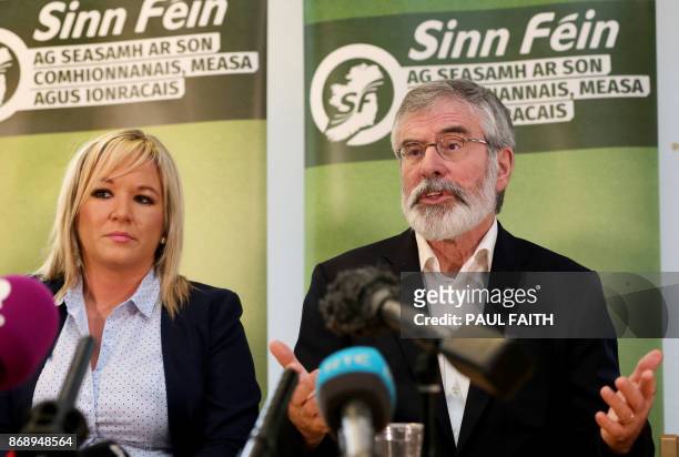 Sinn Fein President, Gerry Adams , accompanied by Northern Leader of Sinn Fein, Michelle O'Neill, speaks at a press conference at Stormont, in...