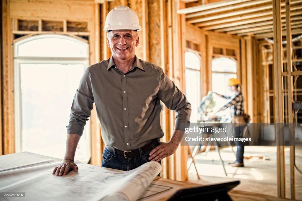 Architect looking over blueprints