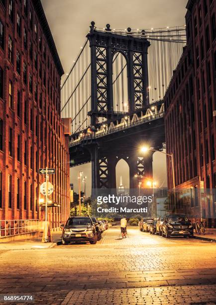 manhattan bridge view from washington street at night - dumbo new york stock pictures, royalty-free photos & images
