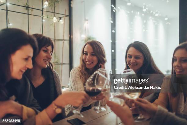 cheers! - girls night in stock pictures, royalty-free photos & images