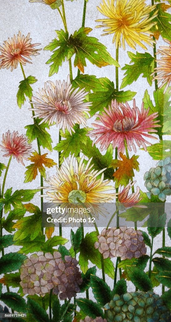 Glass and Wood screen decorated with flowers.