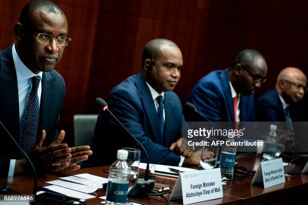 Burkina Faso's Foreign Minister Alpha Barry , Niger's Foreign Minister Ibrahim Yacoubou and Chad's Foreign Minister Brahim Hissein Taha listen while...