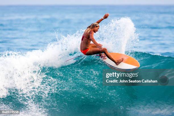 surfing in the caribbean sea - woman surfing stock pictures, royalty-free photos & images