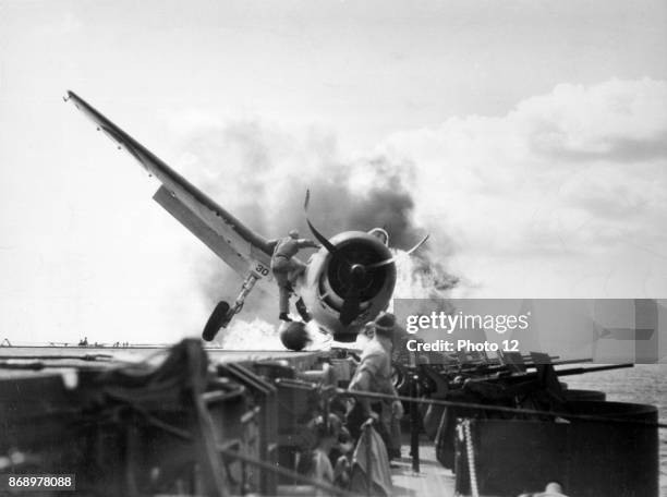 Hellcat crash landed on USS Enterprise's flight deck. World War Two.