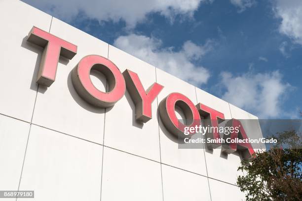 Close-up of sign with logo on building facade at the San Francisco regional headquarters of automotive company Toyota in the Bishop Ranch office park...