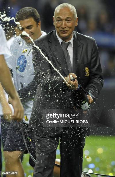Porto's coach Jesualdo Ferreira sprays champagne at the end of their Portuguese First league football match against CD Nacional at the Dragao Stadium...