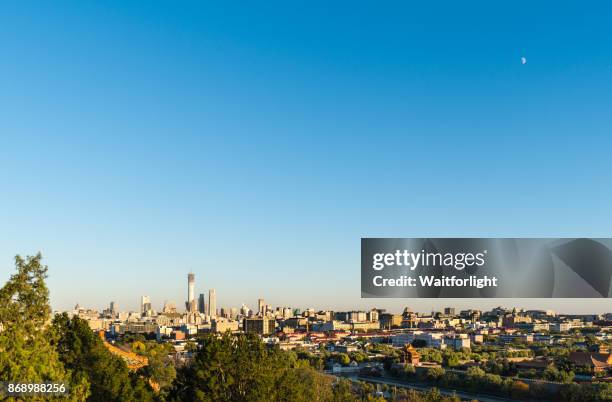 beijing urban skyline at sunset - beijing cctv tower stock pictures, royalty-free photos & images