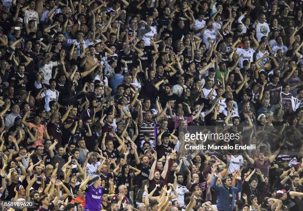 Fans of Lanus cheer for their team after winning a second leg match between Lanus and River Plate as part of the semifinals of Copa CONMEBOL...