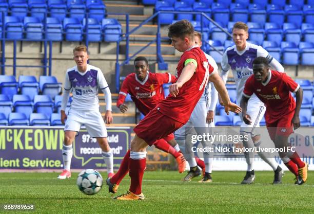 Ben Woodburn of Liverpool scores from the penalty spot during the Liverpool v Maribor UEFA Youth League game at Prenton Park on November 1, 2017 in...