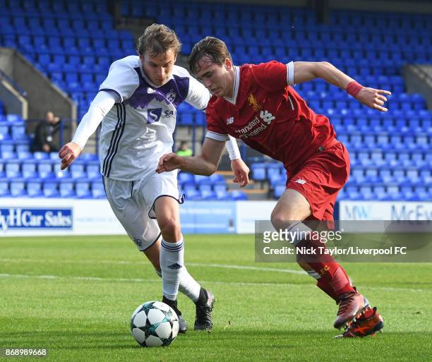 Liam Millar of Liverpool and Zgajner Blaz of NK Maribor in action during the Liverpool v Maribor UEFA Youth League game at Prenton Park on November...