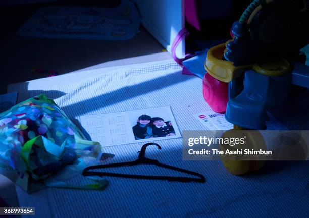 Moonlight shines on a picture in the children's room in an abandoned house on October 4, 2017 in Futaba, Fukushima, Japan. A full moon lights up the...