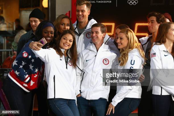 Aja Evans, Ashley Caldwell, Mac Bohohhon and Jamie Greubel Poser and members of Team USA take a selfie during the 100 Days Out 2018 PyeongChang...