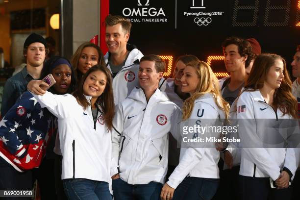 Aja Evans, Ashley Caldwell, Mac Bohohhon, Jamie Greubel Poser and members of Team USA take a selfie during the 100 Days Out 2018 PyeongChang Winter...