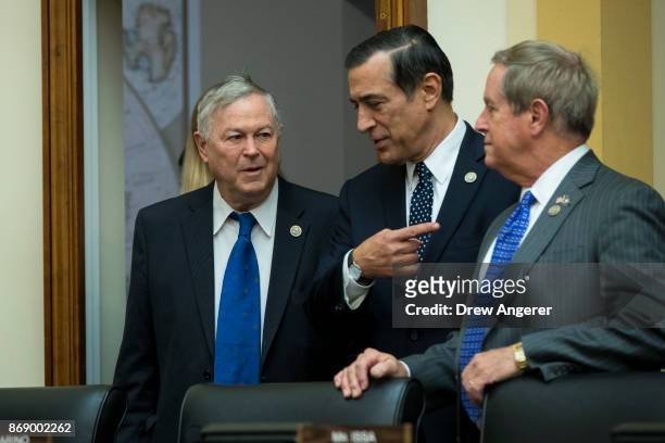 Rep. Dana Rohrabacher , Rep. Darrell Issa and Rep. Joe Wilson await the arrival of Thae Yong-ho, former chief of mission at the North Korean embassy...