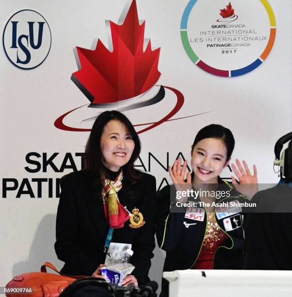 Marin Honda of Japan reacts after competing at the kiss and cry with her coach Mie Hamada in the Ladies Singles Free Skating during day two of the...