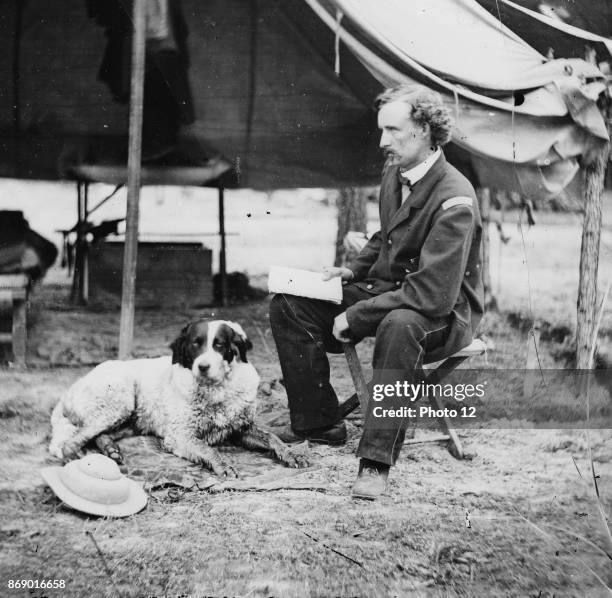 Photographic print of Cavalry Commander George Armstrong Custer with his dog during the American Civil War. Raised in Michigan and Ohio, Custer was...