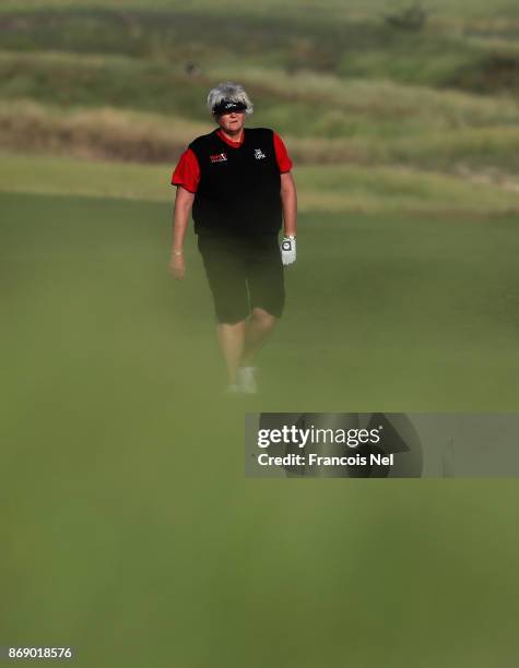 Laura Davies of England walks down the 14th hole fairway during Day One of the Fatima Bint Mubarak Ladies Open at Saadiyat Beach Golf Club on...