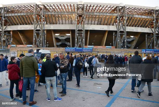 Fans of SSC Napoli walk outside the stadium before the UEFA Champions League group F match between SSC Napoli and Manchester City at Stadio San Paolo...