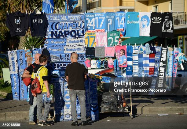 Scarves are displayed for sale at a stall outside the stadium before the UEFA Champions League group F match between SSC Napoli and Manchester City...