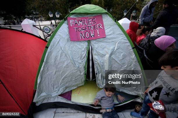 Refugee families protest in front of the Greek Parliament at Syntagma Square against delays in reuniting with their families, Athens, Greece,...